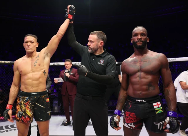 Costello van Steenis has his hand raised beside Fabian Edwards