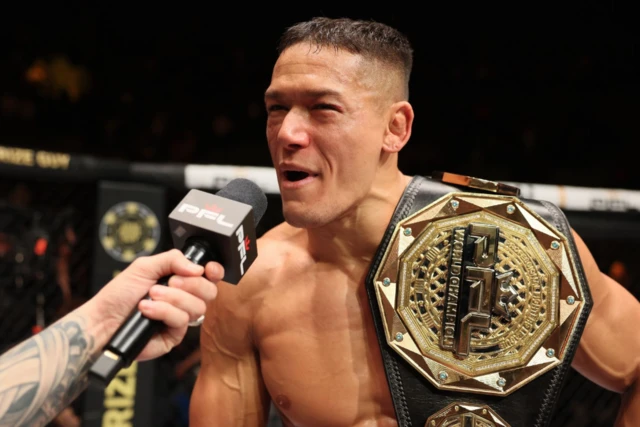 Costello van Steenis speaks on the mic with his PFL title around his shoulder