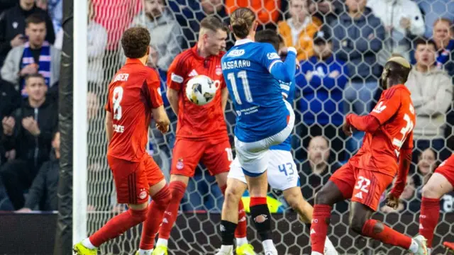 Thelo Aasgaard has a shot blocked for Rangers against Aberdeen