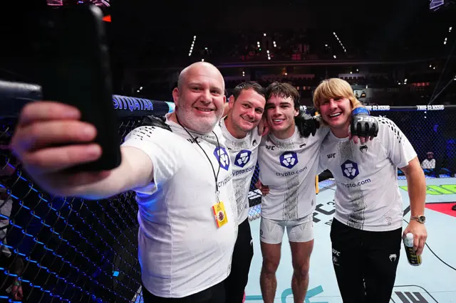 Luke Riley and Paddy Pimblett with their coaches in the UFC octagon