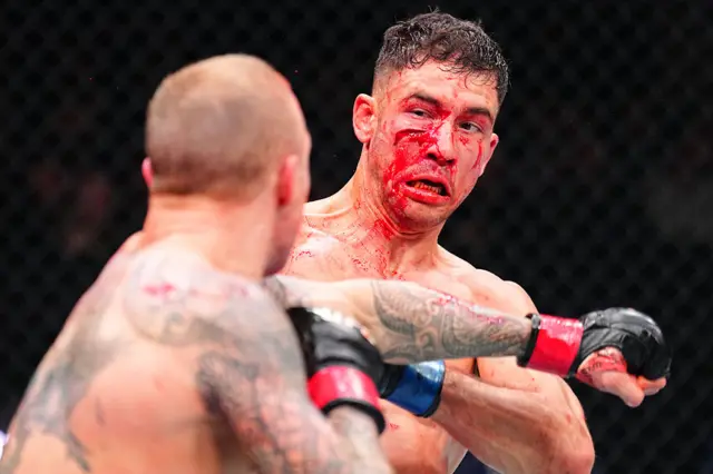 Axel Sola has a open wound on his cheek as he tries to avoid a punch from Mason Jones