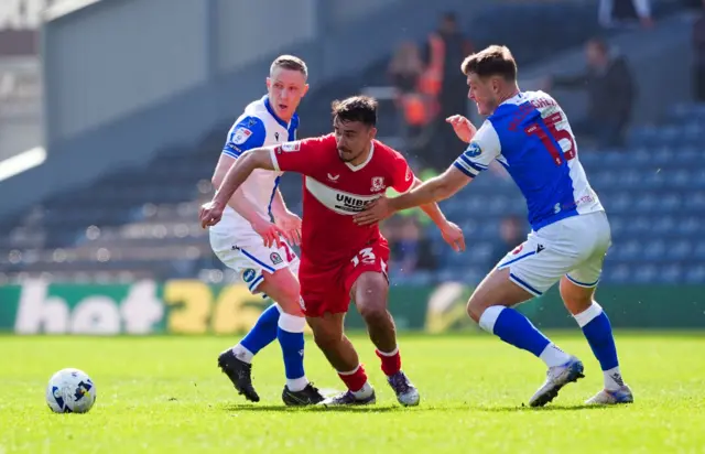 Blackburn Rovers' Adam Forshaw, Middlesbrough's David Strelec and Blackburn Rovers' Sean McLoughlin (right) battle for the ball