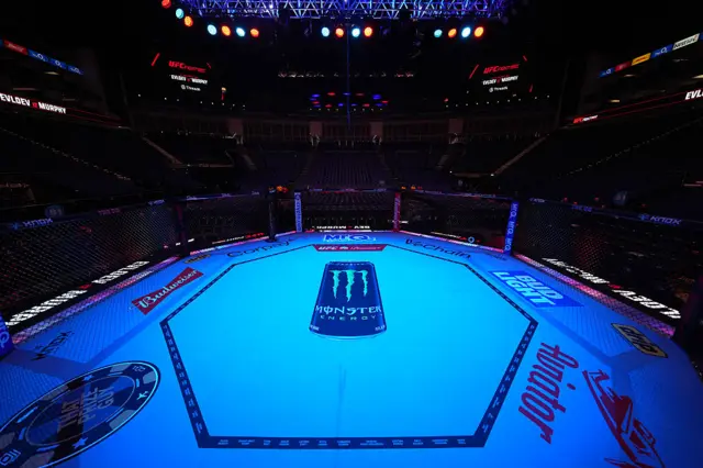 A UFC octagon in an empty arena