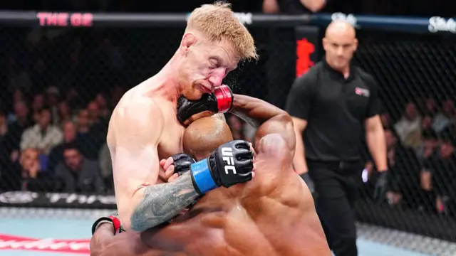 Michael Page and Sam Patterson in a clinch