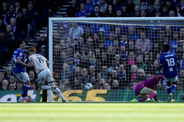 Josh Coburn of Millwall scores