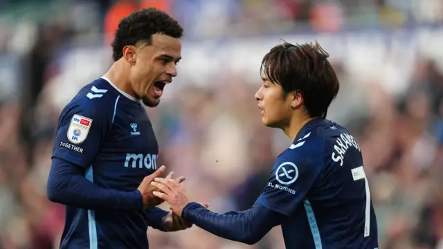 Coventry City's Tatsuhiro Sakamoto celebrates with Joel Latibeaudiere (left) after scoring their side's third goal at Swansea
