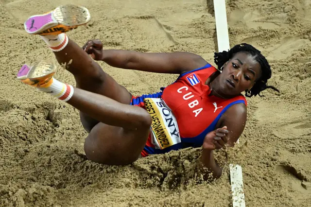 Leyanis Perez Hernandez reacts after her jump