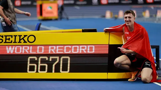 Simon Ehammer reacts after taking gold