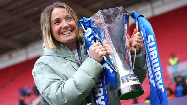 : Sonia Bompastor, Manager of Chelsea, poses for a photograph with the Subway Women's League Cup Trophy