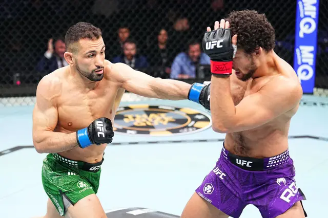 Abdul-Kareem Al-Selwady lands a punch on Shem Rock