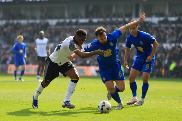 Derby County's Jaydon Banel (left) and Birmingham City's Jack Robinson battle for the ball