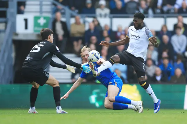Derby County's Patrick Agyemang (right) takes a shot on goal