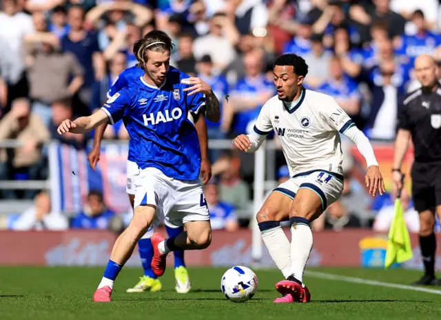 Femi Azeez of Millwall in action against Jack Clarke of Ipswich Town