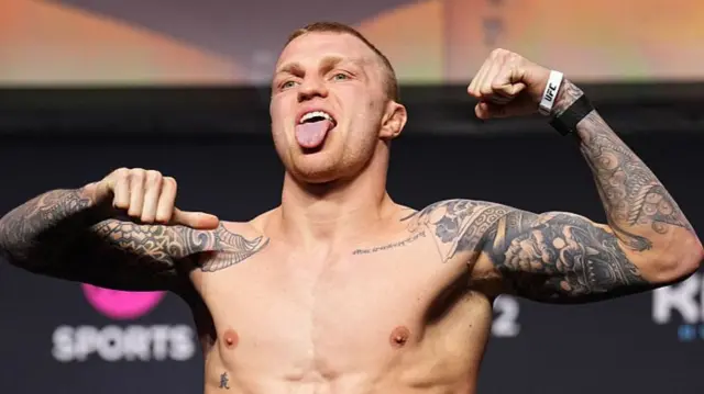 Mason Jones of Wales poses on the scale during the UFC Fight Night ceremonial weigh-in