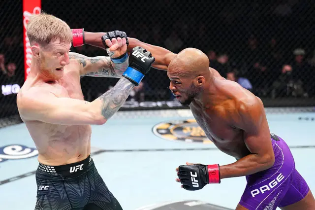 Sam Patterson avoids a punch from Michael Page