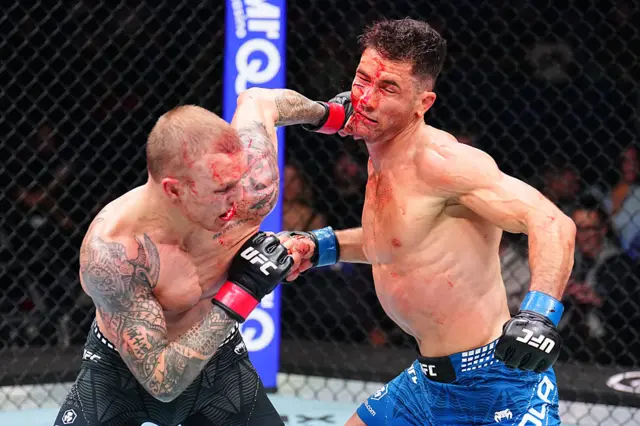 Mason Jones punches Axel Sola, who has a huge cut on his cheek