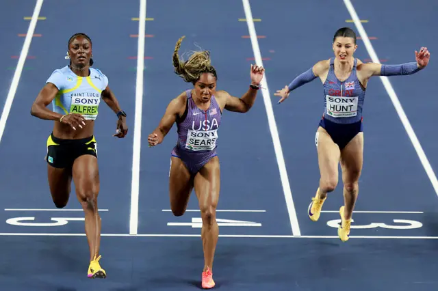 Saint Lucia's Julien Alfred (L), USA's Jacious Sears and Great Britain's Amy Hunt compete