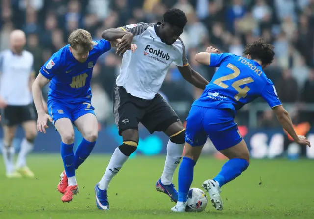 Patrick Agyemang of Derby County pressures Birmingham midfield.