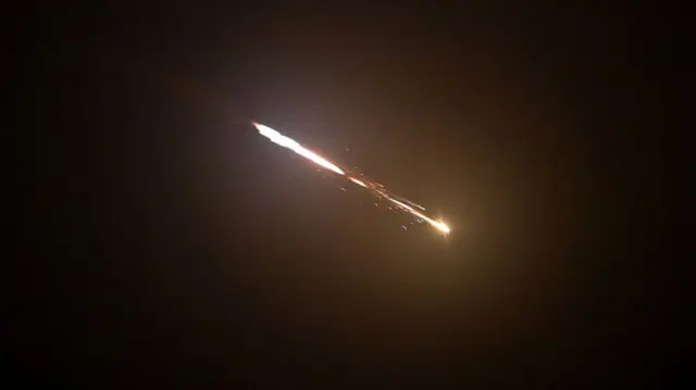 Missiles are seen fragmenting into smaller submunitions mid-air, after the Israeli air defense system was activated to intercept and neutralise the incoming projectiles.