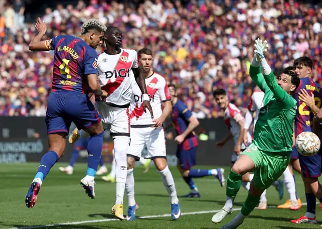 Barcelona's Uruguayan defender #04 Ronald Federico Araujo da Silva scores his team's first goal in spite of Rayo Vallecano's Argentine goalkeeper #13 Augusto Batalla d