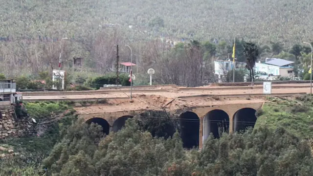 Side view of the Qasmiyeh bridge showing damage to the middle arches following an explosion
