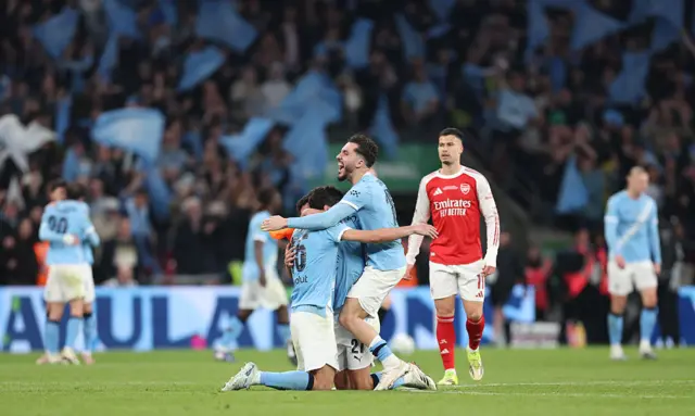 Manchester City celebrate at the final whistle