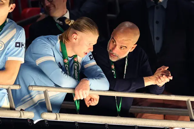 Pep Guardiola (R) and Erling Haaland (L)