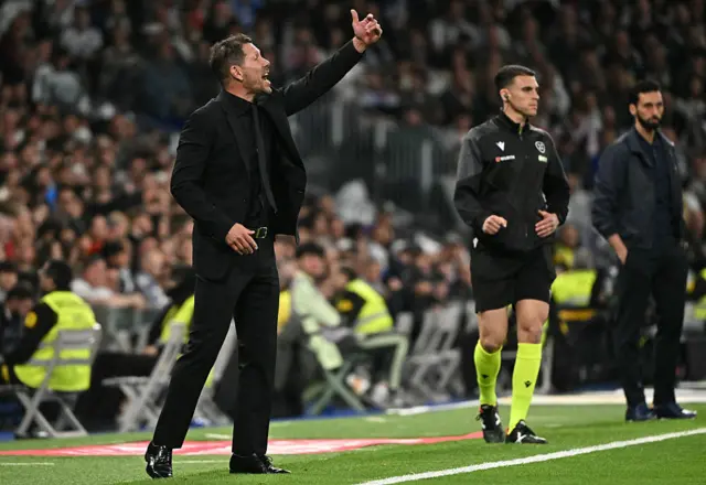 Atletico Madrid's coach Diego Simeone and Real Madrid's coach Alvaro Arbeloa