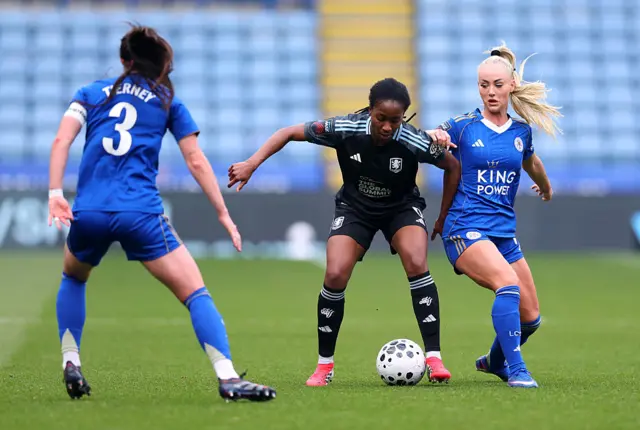 Oriane Jean-Francois of Aston Villa is challenged by Alisha Lehmann of Leicester City