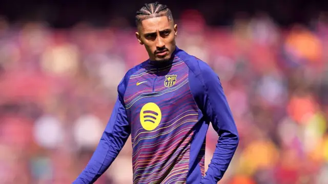 Raphinha of FC Barcelona looks on during the warm up