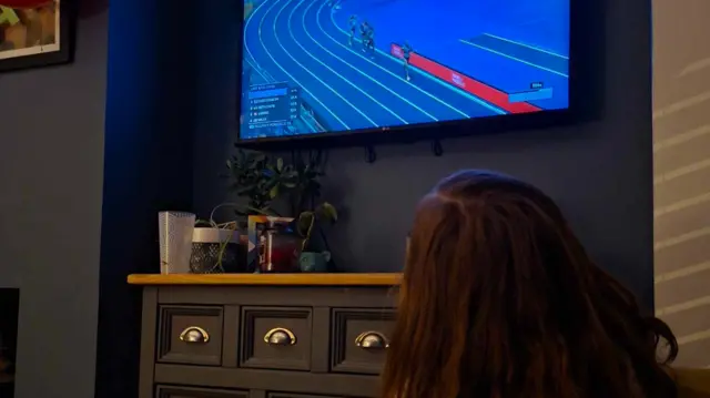 A girl watching Keely Hodgkinson's victory in the women's 800m