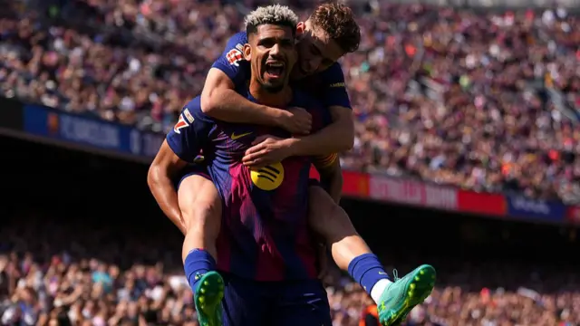 Ronald Araujo of FC Barcelona celebrates scoring his team's first goal with teammate Fermin Lopez