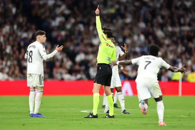 Referee Jose Munuera shows a red card to Federico Valverde