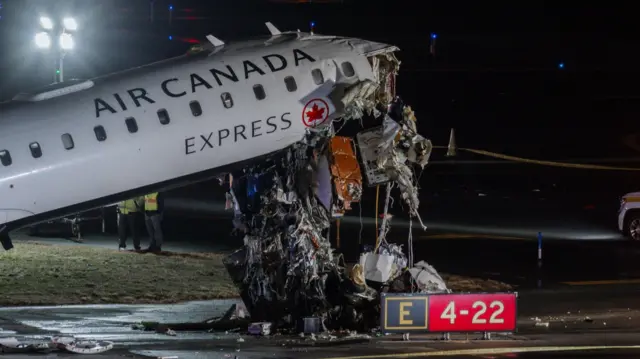 The mangled wreckage of the front of an Air Canada plane