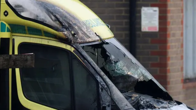 A charred ambulance windscreen