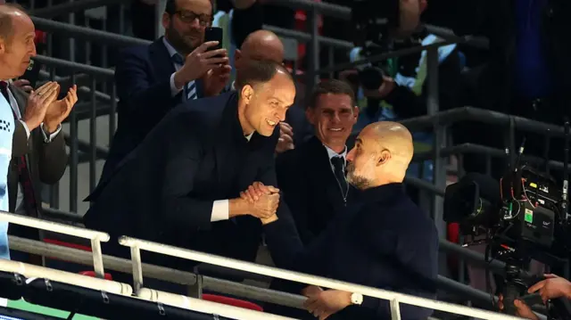 Pep Guardiola is congratulated by England manager Thomas Tuchel