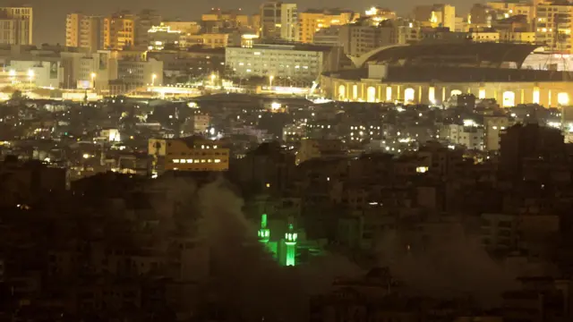 Beirut's skyline with smoke in the foreground