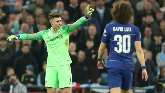 Chelsea goalkeeper Kepa Arrizabalaga argues with manager Maurizio Sarri as he tries to sub him off