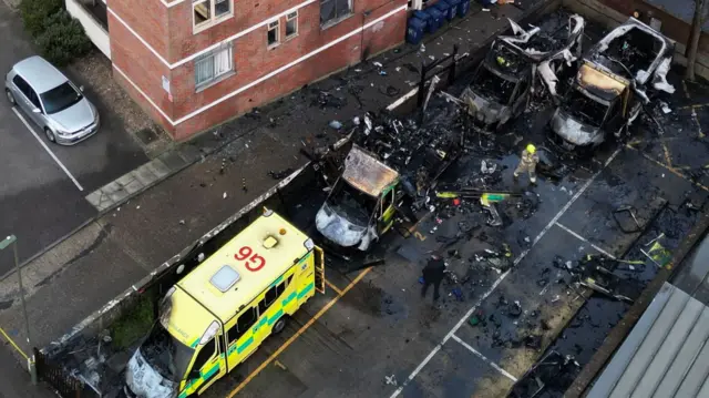 A drone view of four ambulances belonging to Hatzola, a Jewish community organisation, that were set on fire in an incident that the police say is being treated as an antisemitic hate crime