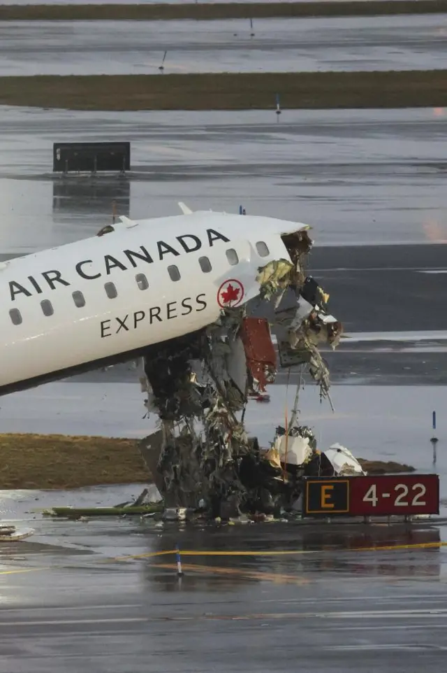 The nose of an Air Canada plane visibly damaged