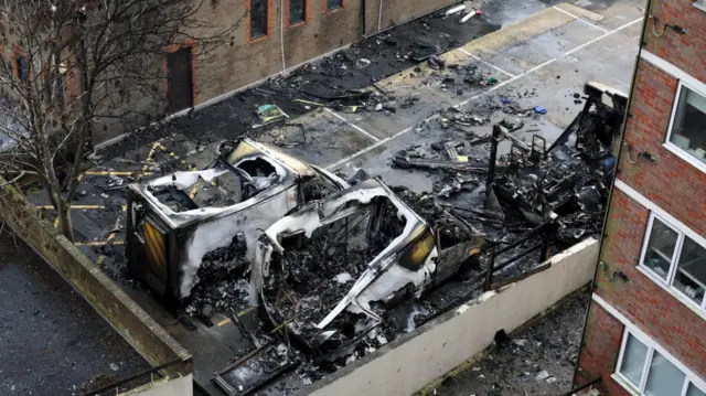 Charred ambulance remains