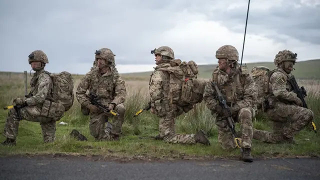 Five British soldiers pictured on a training exercise last summer