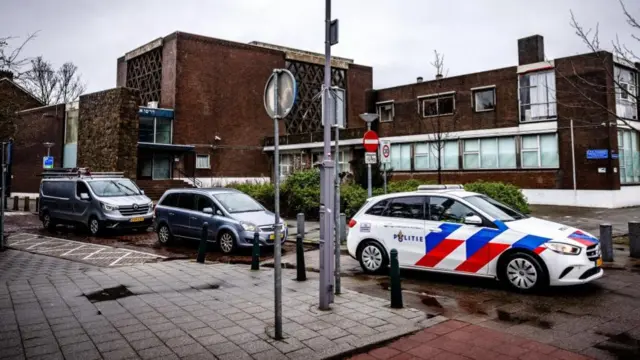 Police car stationed outside a synagogue in Rotterdam earlier this month, after a suspected arson attack