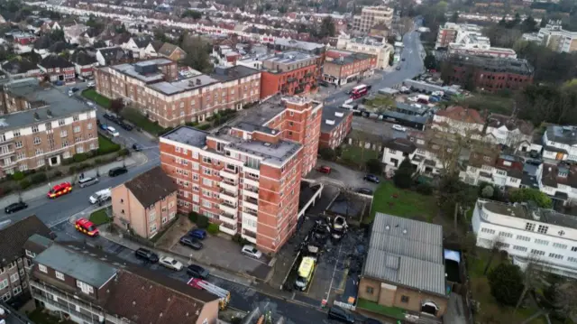 Aerial view of flats and damaged ambulances