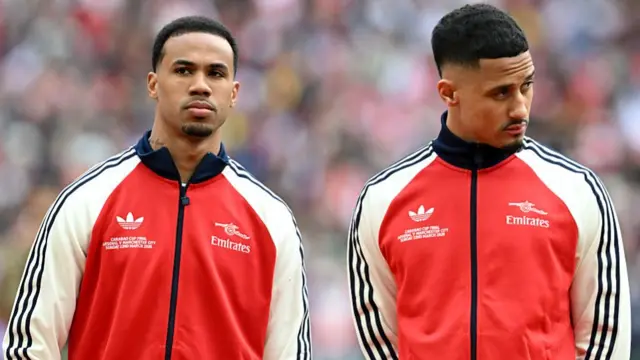 Gabriel and William Saliba of Arsenal look on