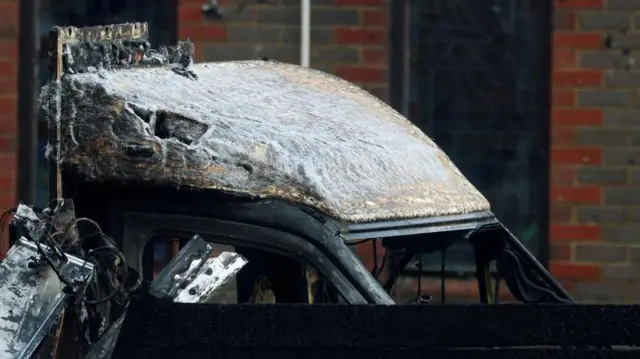 A burnt ambulance, among the four ambulances belonging to Hatzola