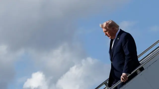 President Donald Trump steps from Air Force