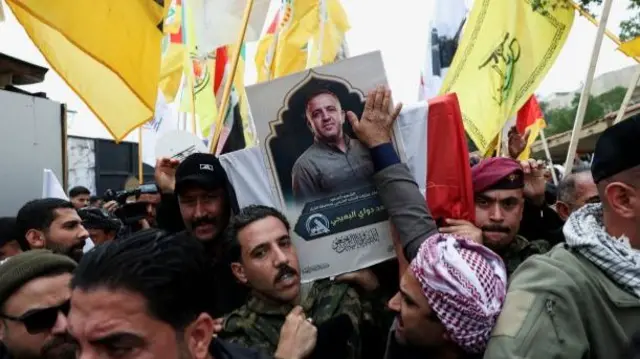 Mourners carry the coffin of Saad al-Baiji, the Popular Mobilisation Forces' Anbar operations commander, who was killed in airstrikes