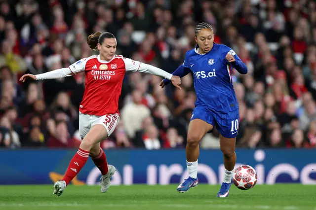 Lauren James of Chelsea is put under pressure by Laia Codina of Arsenal during the UEFA Women's Champions League 2025/26 Quarter-finals First Leg match between Arsenal and Chelsea at Arsenal Stadium