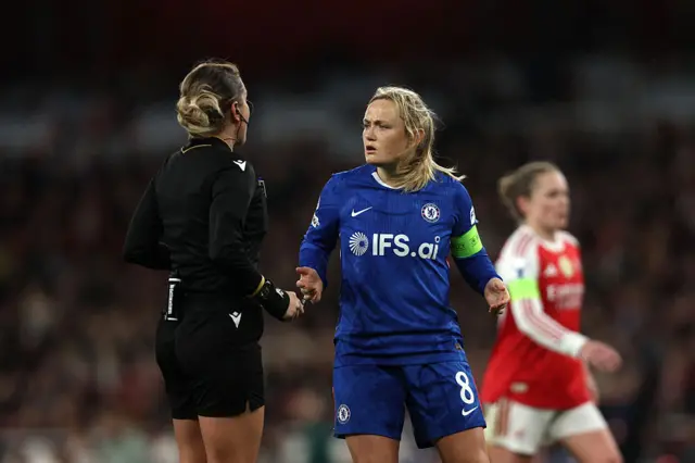 Erin Cuthbert of Chelsea speaks to Referee Alina Pesu during the UEFA Women's Champions League 2025/26 Quarter-finals First Leg match between Arsenal and Chelsea at Arsenal Stadium